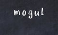 College chalk desk with the word mogul written on in