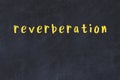 College chalk desk with the word reverberation written on in