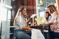 College female students sitting at table working on school assignment in a library Royalty Free Stock Photo