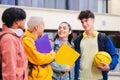 College friends talking in campus, having break after classes Royalty Free Stock Photo