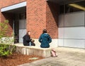 College friends talking over outdoor lunch on a spring day