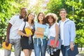 College Friendship Concept. Happy Multiethnic Group Of Students Posing Outdoors