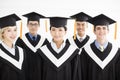 College graduate at graduation with classmates Royalty Free Stock Photo
