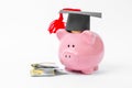 College graduate student, university piggy bank, money. Investment in education Royalty Free Stock Photo