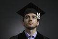 College graduate with tuition price tag, horizontal Royalty Free Stock Photo