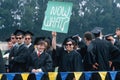 College graduates with sign,