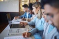 College, laptop and students in classroom lecture for learning, studying and education. Young university student using Royalty Free Stock Photo