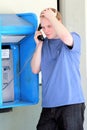 College stress on a Pay Phone Royalty Free Stock Photo