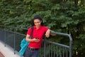 College student with a backpack looking at her cell phone