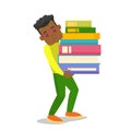 College student carrying a heavy pile of books.