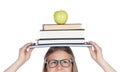 College student charged with books on her head Royalty Free Stock Photo