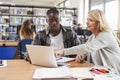 College Student Has Individual Tuition From Teacher In Library Royalty Free Stock Photo