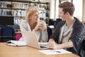 College Student Has Individual Tuition From Teacher In Library Royalty Free Stock Photo