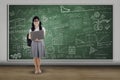 College student holding laptop in class Royalty Free Stock Photo