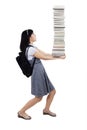 College student holding pile of books Royalty Free Stock Photo