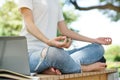 College student meditating on the bench in the college park before start studying afternoon class Royalty Free Stock Photo