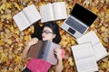 College Student Sleeping on The Autumn Leaves Royalty Free Stock Photo