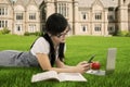 College student texting at field Royalty Free Stock Photo