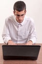 College student using his laptop computer in classroom Royalty Free Stock Photo