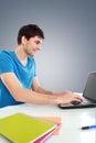 College student using his laptop computer Royalty Free Stock Photo
