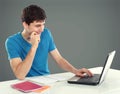 College student using his laptop Royalty Free Stock Photo