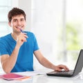 College student using his laptop Royalty Free Stock Photo