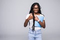 College student young African American woman with notebook in hands isolated on gray background Royalty Free Stock Photo