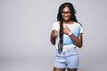 College student young African American woman with notebook in hands isolated on gray background Royalty Free Stock Photo