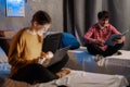 College students guy and girl studying in university dormitory talking preparing for exam. Royalty Free Stock Photo