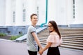 College students holding hands and looking back to the camera Royalty Free Stock Photo