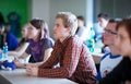 College students sitting in a classroom during class