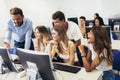 Students sitting in a classroom, using computers during class Royalty Free Stock Photo