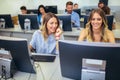 College students sitting in a classroom, using computers Royalty Free Stock Photo