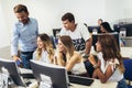 Students sitting in a classroom, using computers during class Royalty Free Stock Photo