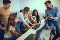 Students sitting in a classroom, using computers during class Royalty Free Stock Photo