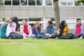 College students sitting in the park Royalty Free Stock Photo