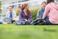 College students sitting in the park Royalty Free Stock Photo