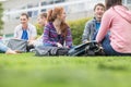 College students sitting in the park Royalty Free Stock Photo