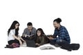College students studying on the floor Royalty Free Stock Photo