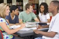 College students studying together in a library Royalty Free Stock Photo