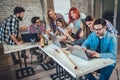 College students using laptop while sitting at table. Royalty Free Stock Photo