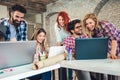 College students using laptop while sitting at table. Royalty Free Stock Photo