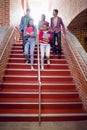 College students walking down stairs in college Royalty Free Stock Photo