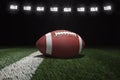 College style football on field with stripe under stadium lights Royalty Free Stock Photo