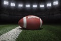 College style football on field with stripe under stadium lights Royalty Free Stock Photo