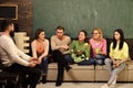 College and university concept. Group of students, group mates listening teacher, lecturer, professor. Students Royalty Free Stock Photo