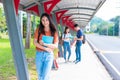 College young Asian students tutoring and reading book at walkway in university. School and friendship theme. Education and Royalty Free Stock Photo