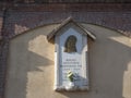 Saint Mary war memorial with latin inscription. in Collegno