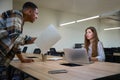 Collegues arguing while working in the office together Royalty Free Stock Photo