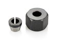 A collet chuck with a clamping nut. Components used in routers and other rotary tools to securely hold bits Royalty Free Stock Photo